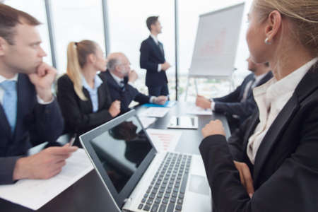 Business people analyzing financial figures of reports