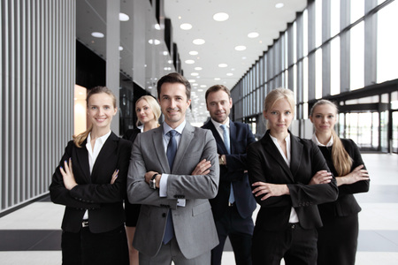 Portrait of successful smiling business team in office buildingの写真素材