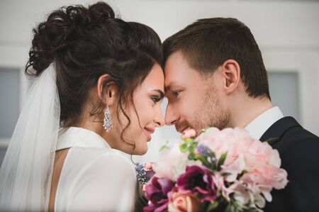 Bride and groom with bridal bouquet ready for weddingの写真素材