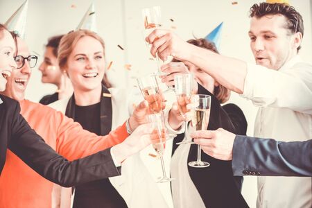 Business people celebrating 2018 New Year at office partyの写真素材