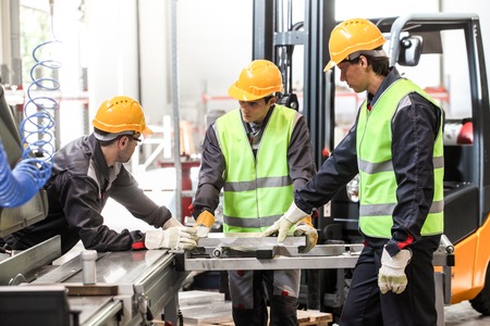 CNC machine shop with lathes, technicians and workers