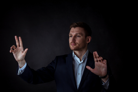 Businessman hand touching virtual screen, modern background concept , copy space for design or textの写真素材