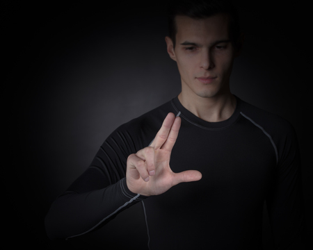 Man touching futuristic invisible display, innovation, future concept, copy space for text or designの写真素材