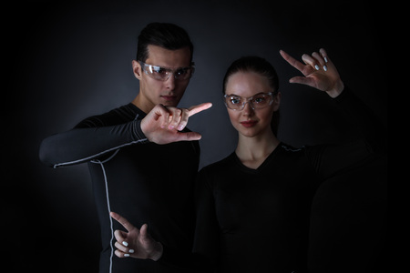 Couple working with futuristic display, innovation, future concept, copy space for text or designの写真素材