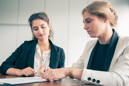 Business women Signing Contract at meeting close up viewの写真素材