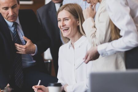 Business team interacting at meeting Focus on happy laughing woman , joy , success, unity conceptの写真素材