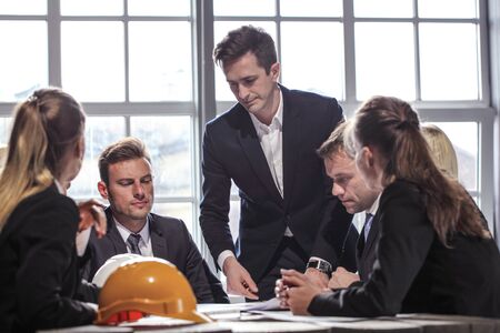 Group of Architects planning construction together at business meetingの写真素材