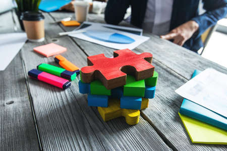 Puzzle pieces on office meetng table, business vision and problem solution conceptの写真素材