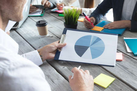 Business people analyzing data diagrams financial reports development strategyの写真素材
