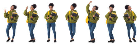 Set of full length portraits of smiling african student carrying a backpack and holding copybooks isolated on white backgroundの写真素材