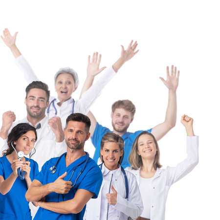 Group Of Happy Doctors Raising Their Arms Isolated Against White Backgroundの写真素材