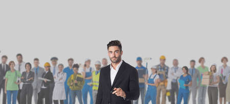Businessman pointing at you in front of crowd of different industries professions people cooperation job search staff management conceptの写真素材