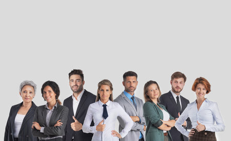 Group happy colleagues a business team isolated on gray background with copy space for text contentの写真素材