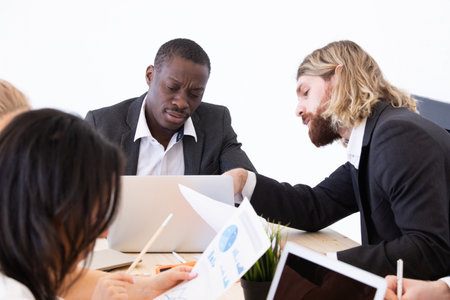 Diverse executive business people team discussing work results at meeting, multiracial businessmen...