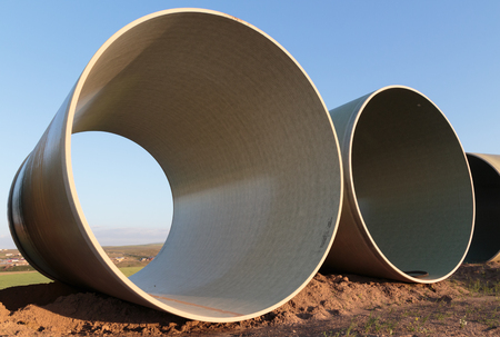 Large concrete pipes waiting for infrastructure work.
