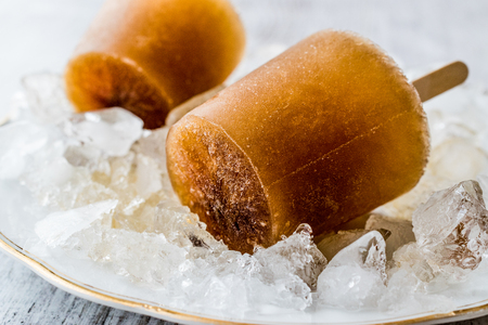 iced tea, caramel and coffee popsicles on a stick. Summer Dessert Concept.の写真素材