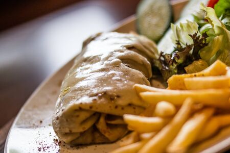Crepe with cheese, lettuce and fries.の写真素材