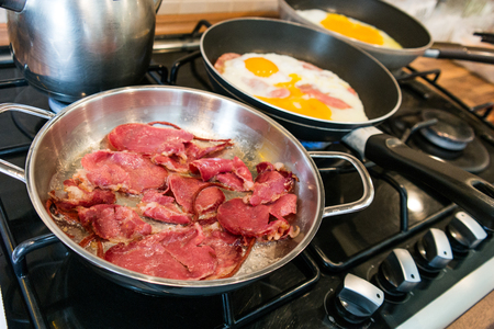 turkish pastirma - bacon in a frying pan at home in the moms kitchenの写真素材