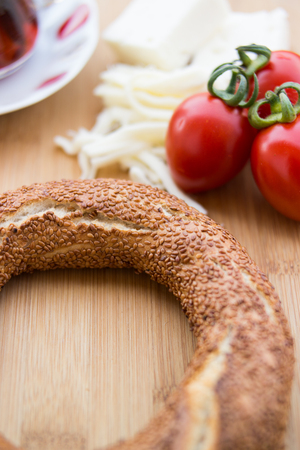 Turkish Bagel Simit with cherry tomatoes and tea.