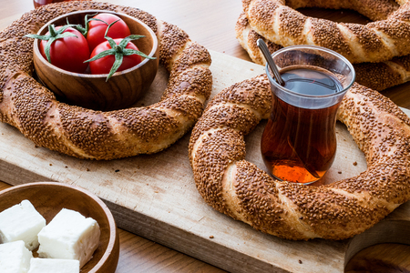 Turkish Bagel Simit with tea, cheese and cherry tomatoes. (ramadan concept)の写真素材