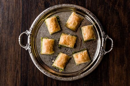 Turkish Dessert Baklava with pistachio on silver tray. Dessert Concept.の写真素材