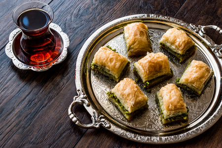Turkish Dessert Baklava with tea on silver tray. Desset Concept.の写真素材