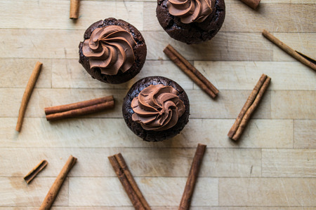 Chocolate cupcakes with cinnamon sticks.の写真素材