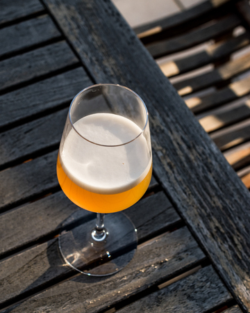 Bellini Cocktail made with peach in wine glass at garden. Beverage Concept.の写真素材