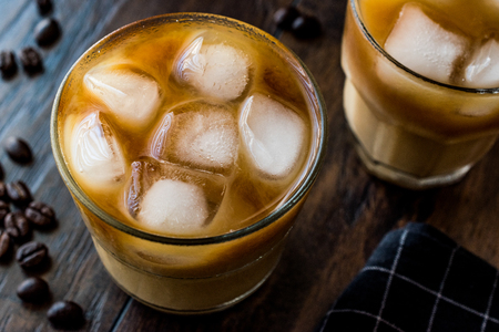 Cold brew coffee with milk and ice. (iced coffee). Organic Beverage.