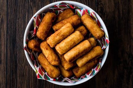 Potato croquettes (croquetas) on wooden surface. Fast Food.の写真素材