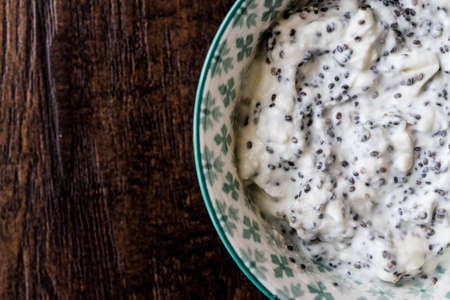 Yogurt with Chia Seeds in ceramic cup. Organic Concept.の写真素材