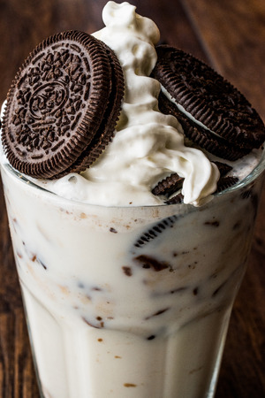 Vanilla Milkshake with chocolate cookies and black straw. Beverage Concept.の写真素材