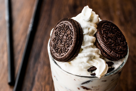 Vanilla Milkshake with chocolate cookies and black straw. Beverage Concept.の写真素材