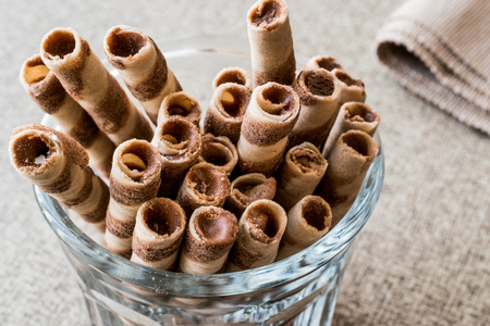 Wafer rolls in glass cup. Dessert concept.の写真素材