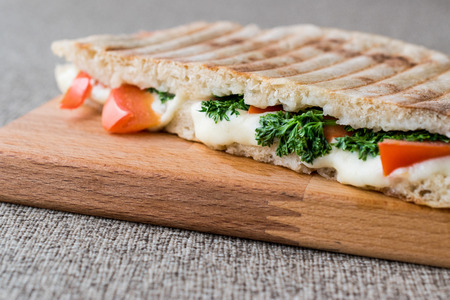 Turkish Bazlama Tost / Toast sandwich with melted cheese, tomatoes and dill. fast foodの写真素材