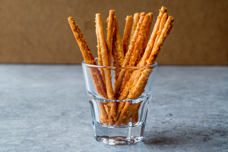 Salty Pretzel Crunchy Sticks Standing in Glass. Fast Food.