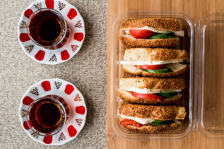 Turkish Bagel Simit Sandwich with cheese, tomato, cucumber and tea. fast foodの写真素材