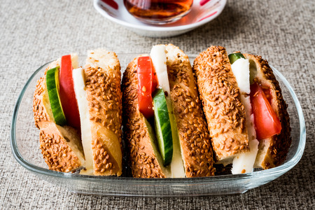 Turkish Bagel Simit Sandwich with cheese, tomato, cucumber and tea. fast foodの写真素材