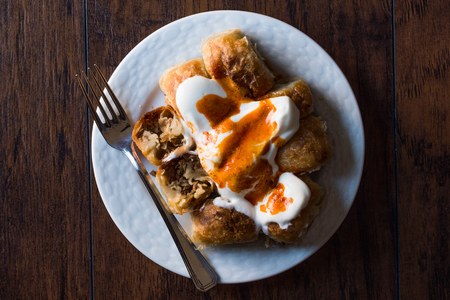 Bosnian Pastry Manti with Yogurt and Fried Butter Sauce / Bosnak Borek. Traditional Food.