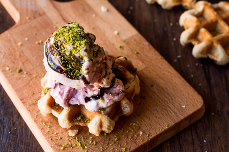 Belgium Waffle with ice cream on wooden surface. Traditional Food.の写真素材
