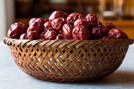 Red Jujube Fruits in Wooden Basket. Organic Food.の写真素材