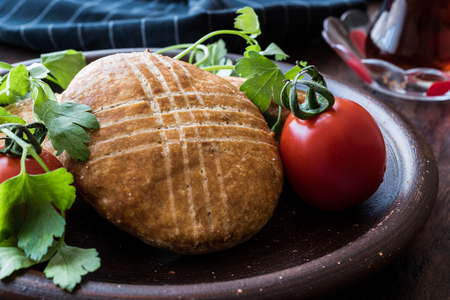 Turkish Pastry with tea  Karakoy Pogacasi on  a wodden surface.の写真素材