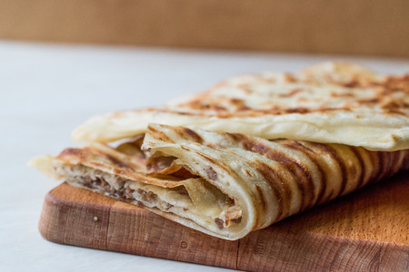 Traditional Qutab or Gozleme made with Dough, Minced Meat or Cheese. Fast Food.