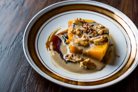 Turkish Pumpkin Dessert with Tahini and Walnut / Kabak Tatlisi. Traditional Dessert.の写真素材