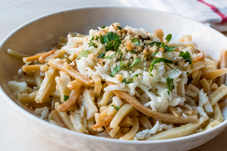 Turkish Noodle / Eriste with cheese, walnuts and parsley. Traditional Food.