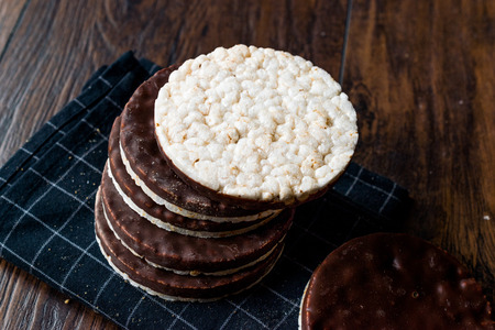 Stack Of Dark Chocolate Covered Rice Cakes or Corn Crackers. Appetizer Concept.