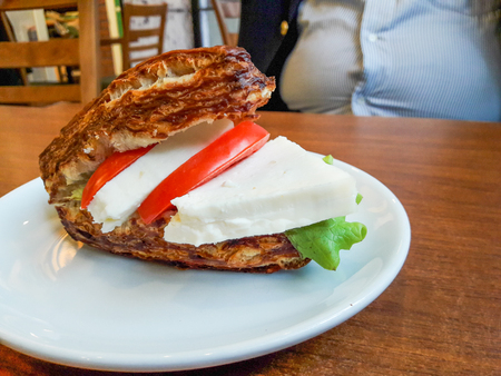 High Calorie Food. Soda Bread Tomato and Cheese Sandwich with Belly Fat Man. Concept. Foodの写真素材
