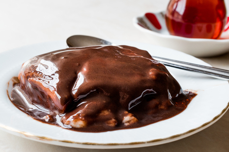 Turkish Pudding Muhallebi with Chocolate Sauce and Traditional Tea. Dessert Concept.の写真素材