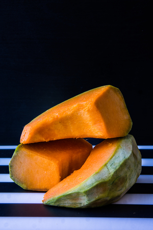 A pumpkin is a cultivar of a squash plant, most commonly of Cucurbita pepo, that is round, with smooth, slightly ribbed skin, and deep yellow to orange coloration.の写真素材