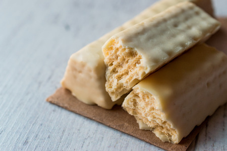 White Chocolate Wafer on wooden surface. Dessert. Concept.